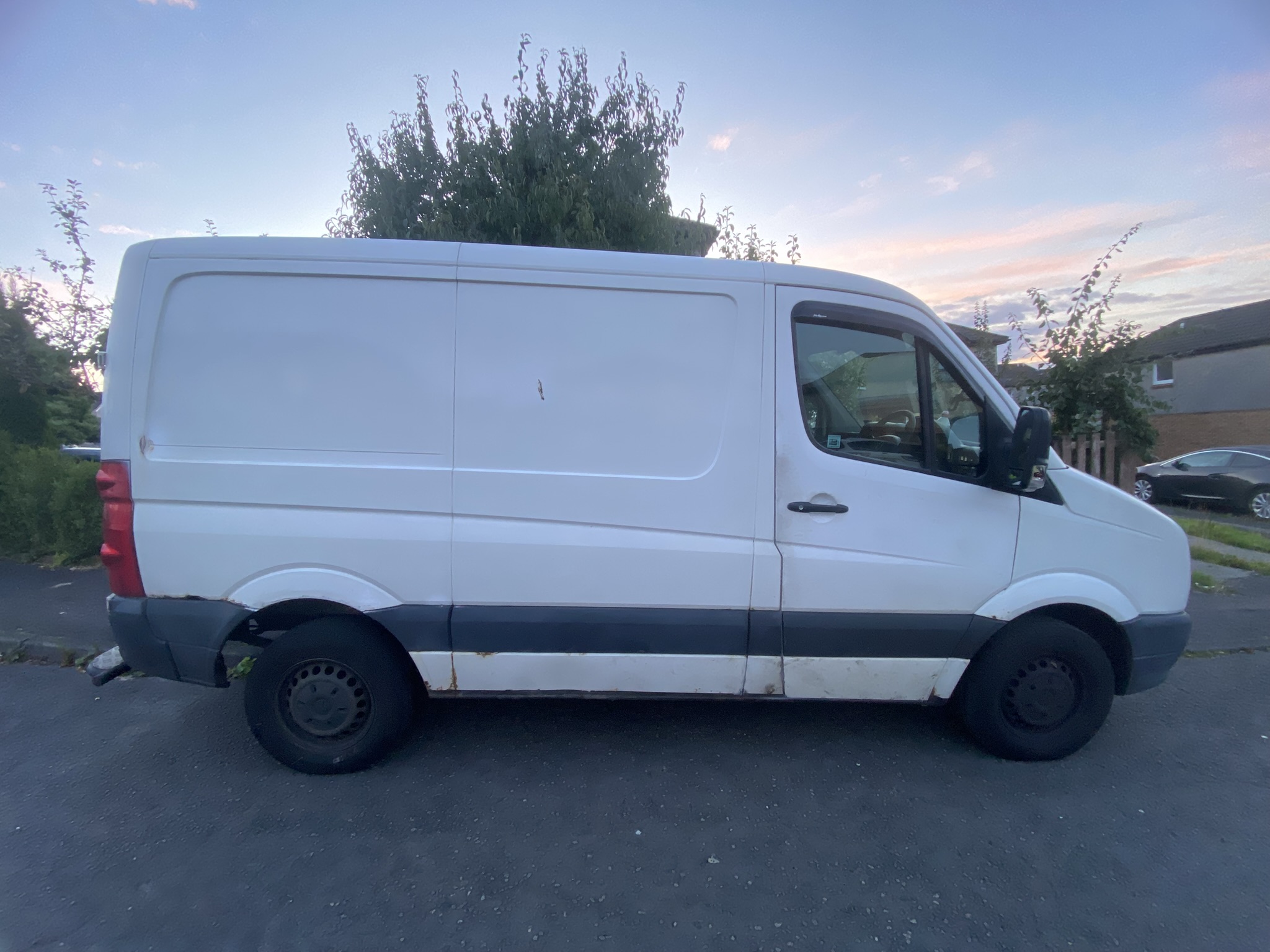 Short wheelbase Volkswagen Crafter van used for moving goods and homes by Men with Ven.